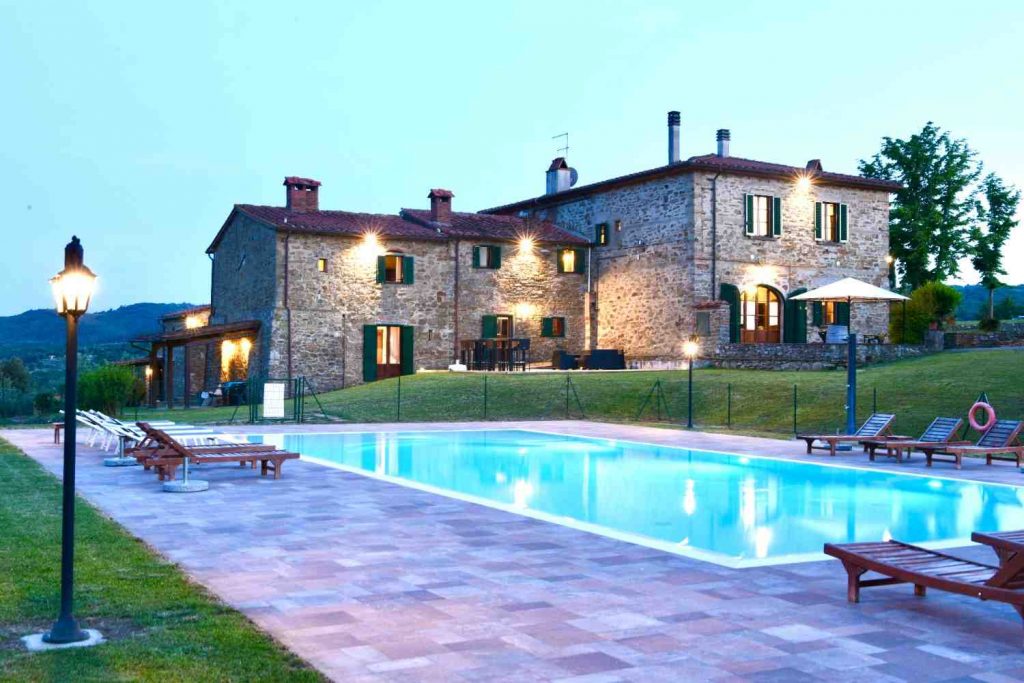 Relax by our swimming pool and terrace belonging to our rental apartments in Central Tuscany